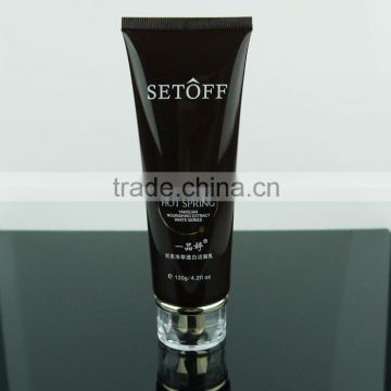 black cosmetic plastic tube with acrylic cap