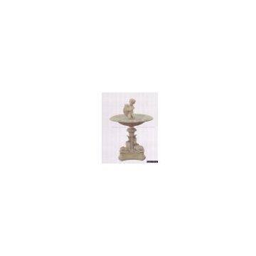 Fountain with boy holding fish