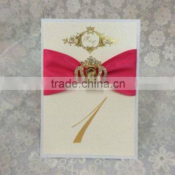 fold tablenumber with matching ribbon of invitationswedding invitations table