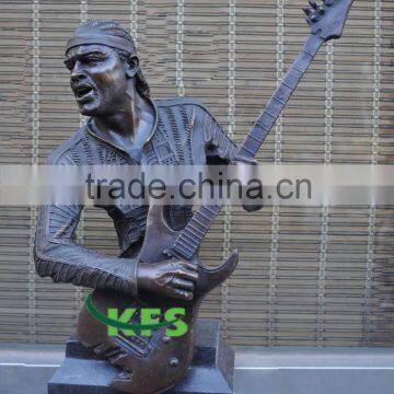 Bronze playing guitar exotic man sculpture