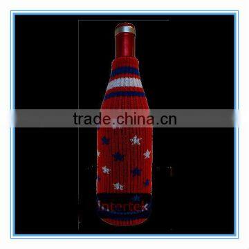 Red knitted wine bottle cover with stars