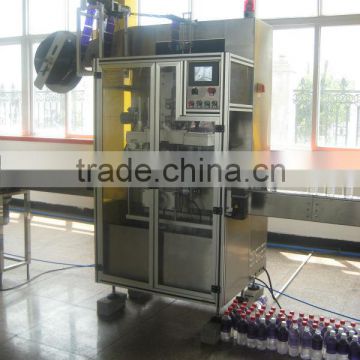 Mineral water bottle sleeve labeling machine and shrink tunnel