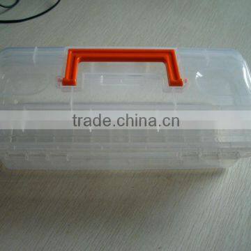 White plastic toolbox with red handle