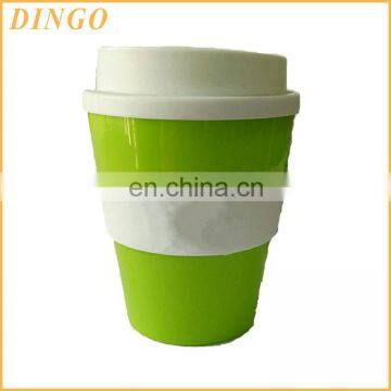 Best selling promotional gift plastic coffee mug with lid and coated with silicone jacket customized logo printing