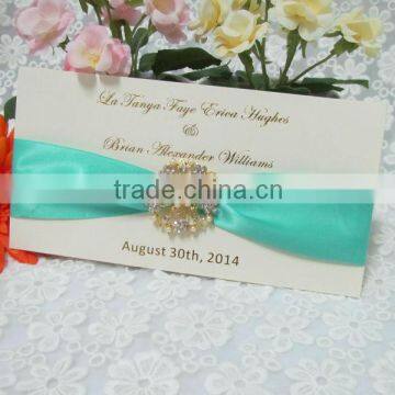 luxurious wedding invitation card with crystal and ribbon