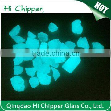 Blue green glowing glass chips for garden decoration