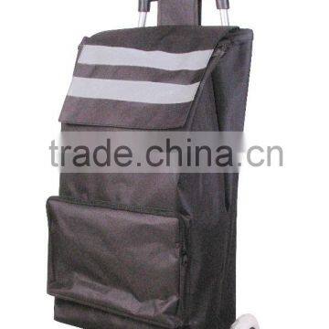 Folding shopping trolley bag with reflective strips, a zip pocket on the front