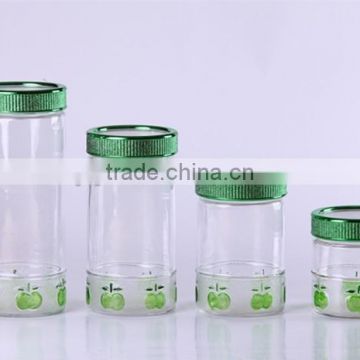 colored round glass canister with handdrawing