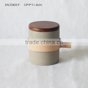 Matte concrete candle jar with bamboo lid and leather handle