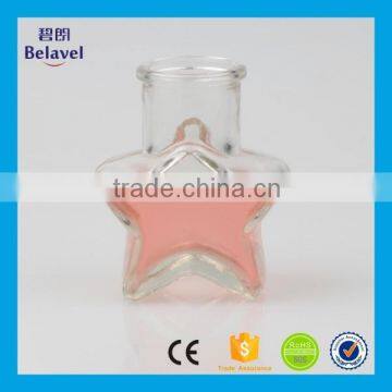 Hot sale star shape wedding decoration clear glass mini bottle