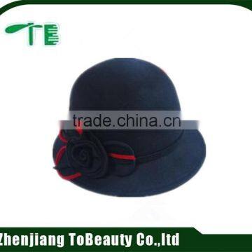 customized navy felt hat with flower accessory