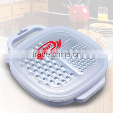 Grate & Stow Grater With Container - includes a multi-function stainless steel grater, clear plastic compact container and lid