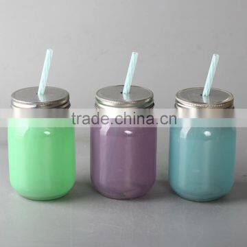 Glass mason jar with straw and lid