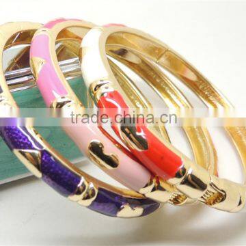 Gold plated heart shape metal bangle with enamel