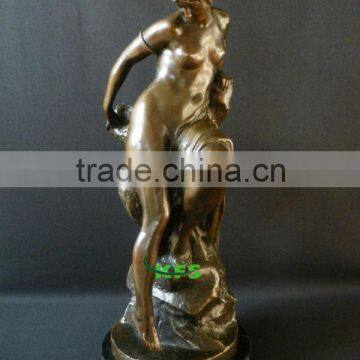 Naked bronze woman figure