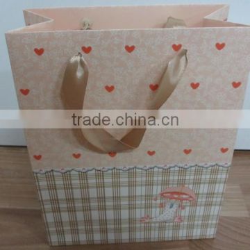 Beautiful ribbon handle gift bag paper