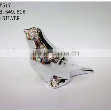 silver bird figurine in silvery bird decoration