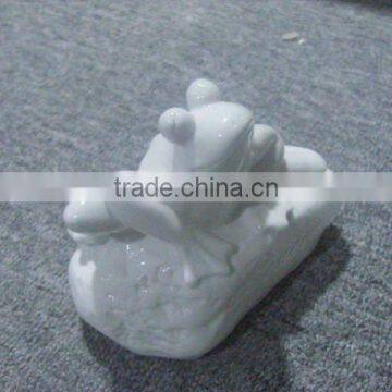 white porcelain frog