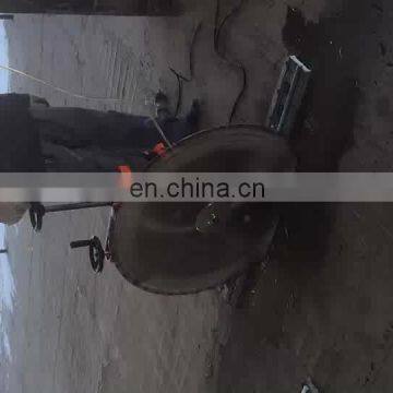 Portable concrete wall slot cutting machine with diamond saw blade