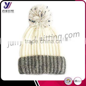 Fashionable jacquard knitted hats and caps with pom pom cheap imported from china (Accept the design draft)