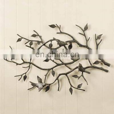 aluminium cast leaf and bird wall art