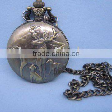 bronze-coloured pocket watch