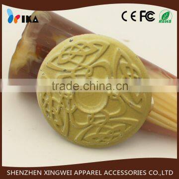 yellow metal shank button with patterns