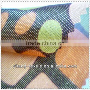 Gold metallic silk fabric with printed pattern