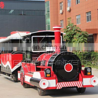 Scenic amusement park fairground attractions rides road sightseeing tourist trackless train