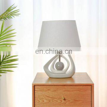 Popular solid geometry design ceramic base bedside night lamp for hotel decor