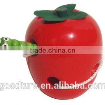 Wooden Caterpillar Eating Red Apple