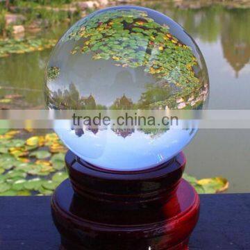 clear crystal ball with red wooden base