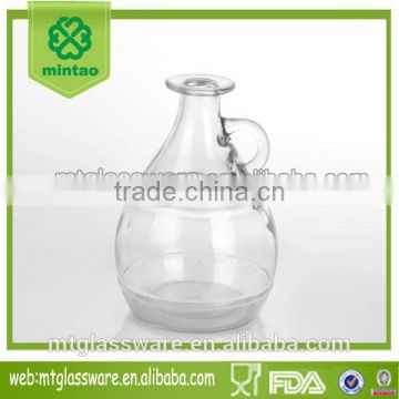 round clear glass wine bottle