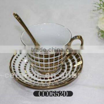 gold rim ceramic coffee cup and saucer