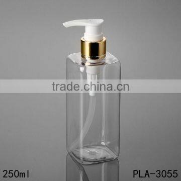 wholesale cosmetic packaging 250ml plat shoulder lotion pet clear rectangle plastic shampoo bottle golden aluminum pump