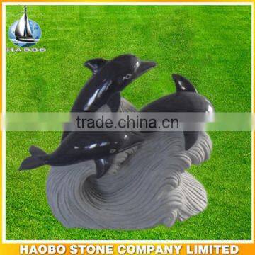 Stone sculpture of sea animal 3 happy dolphins