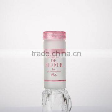 clear glass bottle with flat lid