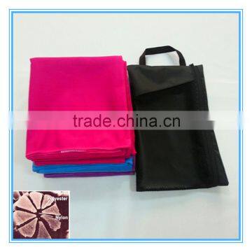 fuscia microfiber beach towel in flat mesh bag