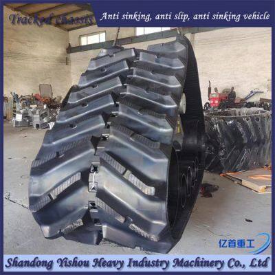 Corn harvester modified with triangular track wheels for anti slip and anti sinking