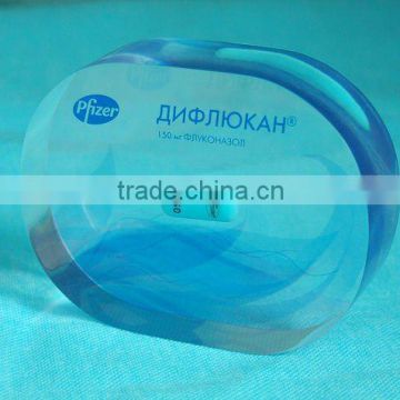 acrylic paper weight with goods inside