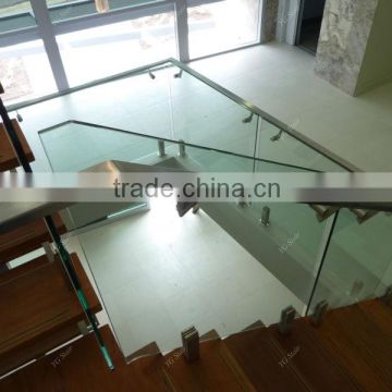 Indoor stairway system with glass railing