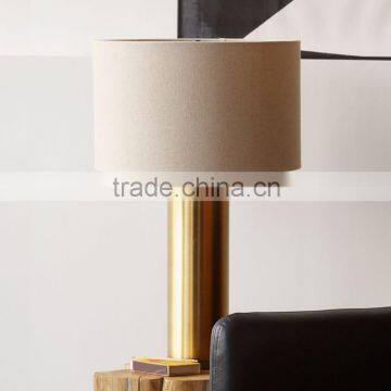 0627-12 antique brass-finished base and natural linen shade Straight and narrow Antique Brass Pillar Table Lamp