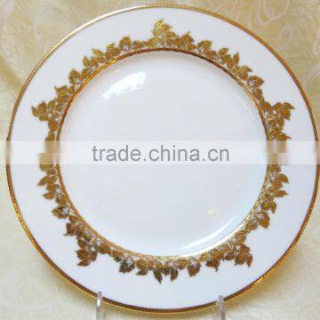 Gold dinnerware plate with colorful designs