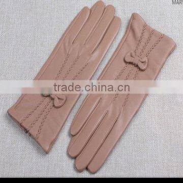 Women wearing pink girls party sheepskin leather glove with bow