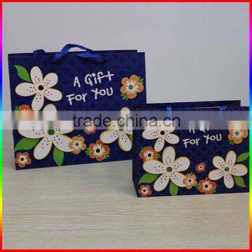 fashionable colourful paper gift packing bag with flower design