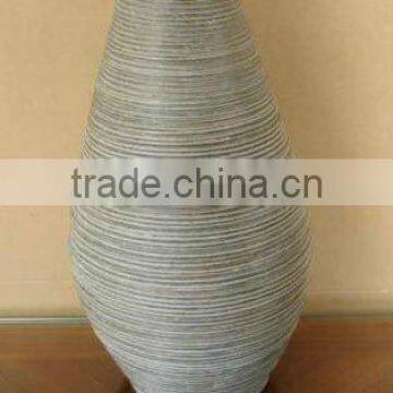 Plastic rattan flower vase with wooden linner.