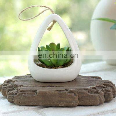 Wholesale White Ceramic Hanging Planters Flower Pot Faux Succulent Plant Pot Artificial Plant Wall Hanging Pot With Hemp Rope