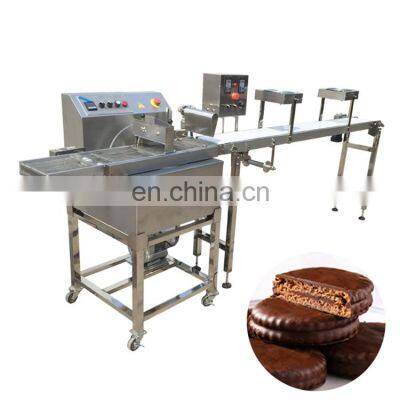 Coating machine in snack food production, biscuit spreading machine with chocolate cooling tunnel