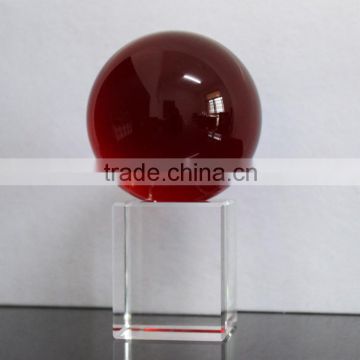 Decorative red crystal ball with transparent base