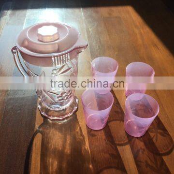 plastic colorful jug with four plastic cup